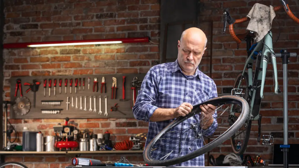 Bike mechanic changing a bike inner tube