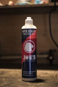 Tubeless tire sealant on a wooden table