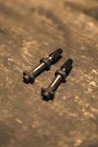 Tubeless valves on a wooden table