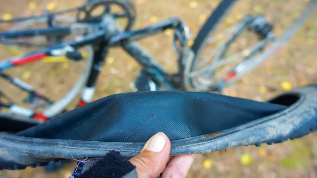 Close up view of a punctured bicycle tire