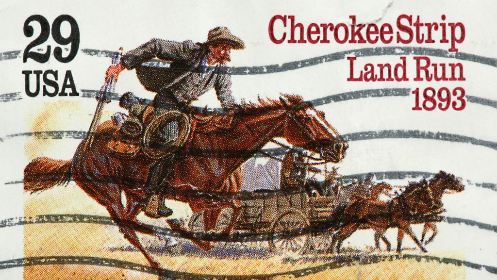 stamp illustrating a land run in oklahoma